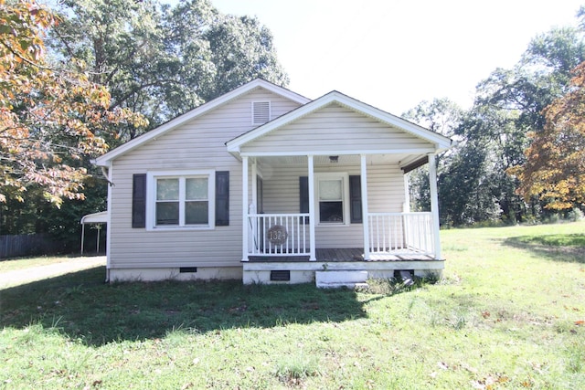 bungalow with a front lawn and a porch