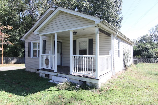 bungalow-style house featuring a porch and a front lawn