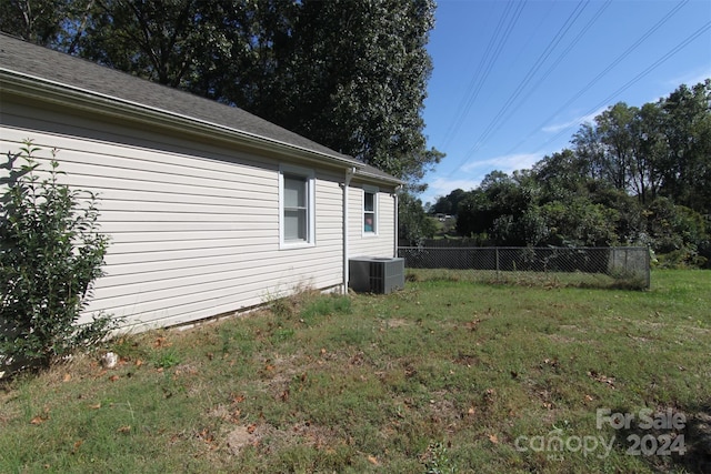 view of yard with central AC