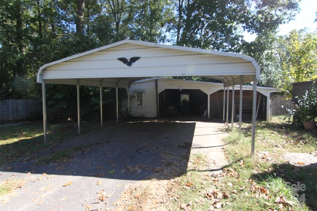 view of parking / parking lot with a carport