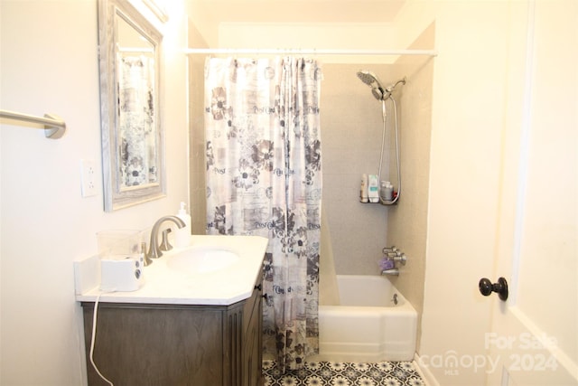 bathroom featuring shower / tub combo and vanity