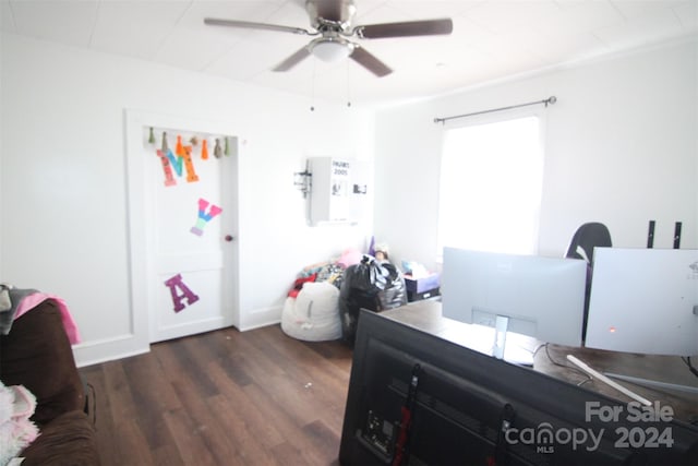 bedroom featuring dark hardwood / wood-style flooring and ceiling fan