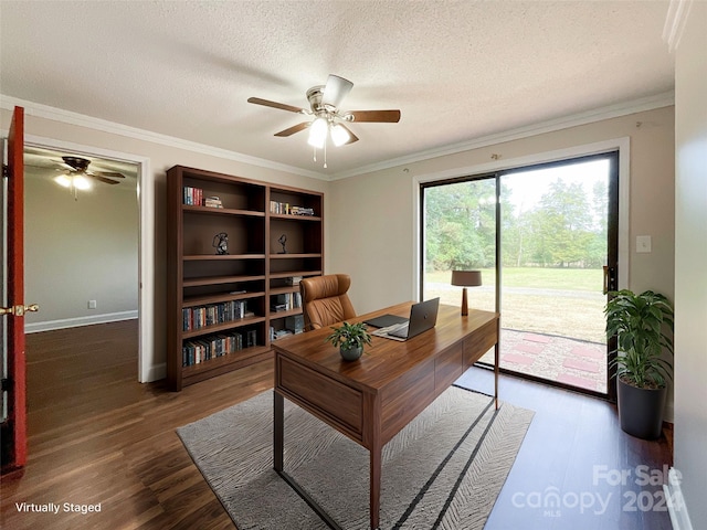 office space featuring ornamental molding, ceiling fan, dark wood-type flooring, and a textured ceiling