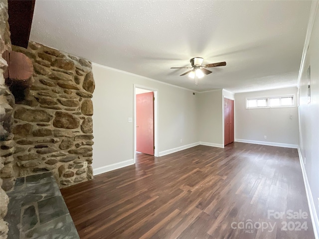 spare room with ornamental molding, ceiling fan, dark hardwood / wood-style floors, and a textured ceiling