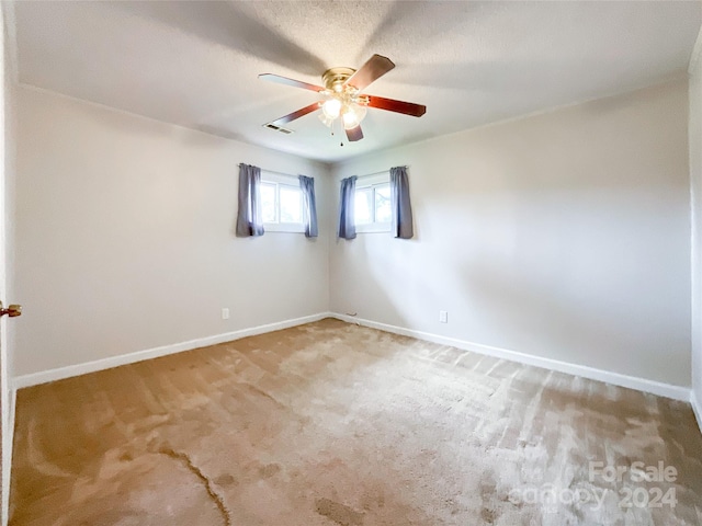 unfurnished room with carpet floors and ceiling fan