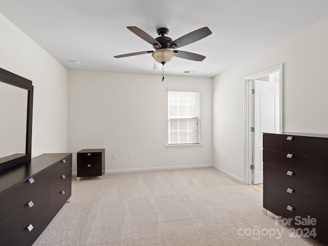 unfurnished bedroom featuring ceiling fan and light colored carpet