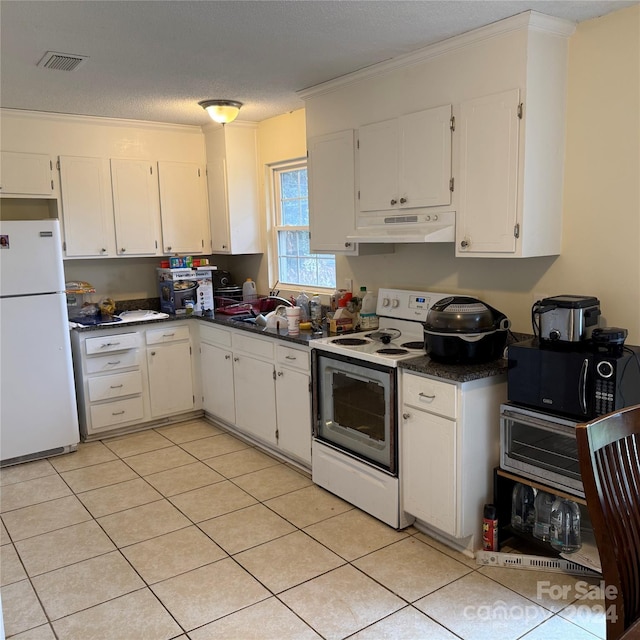 kitchen featuring ornamental molding, white appliances, a textured ceiling, light tile patterned floors, and white cabinets