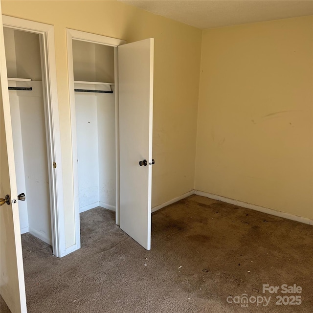 unfurnished bedroom featuring carpet flooring