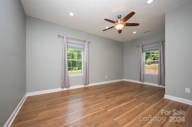 spare room with ceiling fan and hardwood / wood-style floors