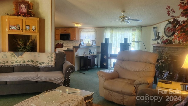 carpeted living room with a fireplace, ceiling fan, and a textured ceiling