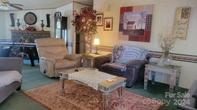 carpeted living room with ceiling fan