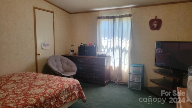 carpeted bedroom featuring ornamental molding and lofted ceiling