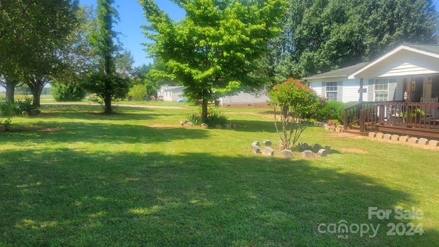 view of yard featuring a deck