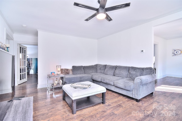 living room with ornamental molding, ceiling fan, and dark hardwood / wood-style flooring