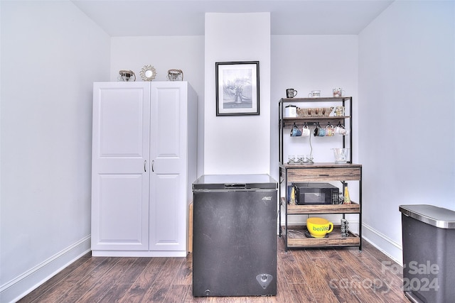 miscellaneous room featuring dark hardwood / wood-style flooring