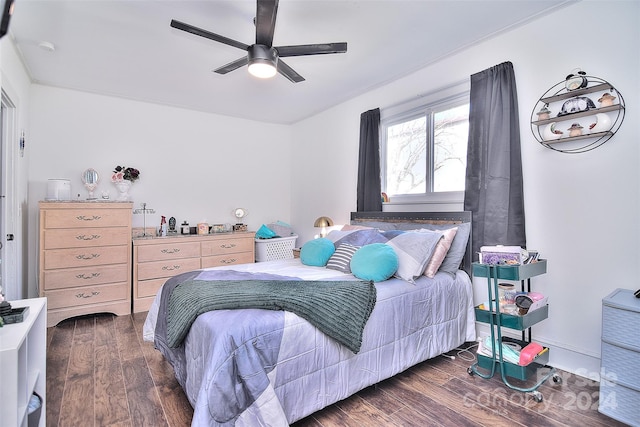 bedroom featuring dark hardwood / wood-style floors and ceiling fan