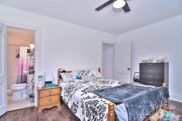 bedroom featuring dark wood-type flooring, ceiling fan, and ensuite bathroom