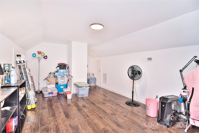 miscellaneous room featuring lofted ceiling and dark hardwood / wood-style floors