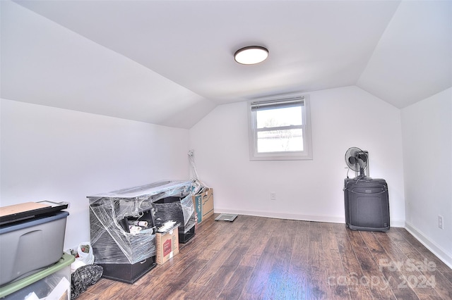 bonus room with vaulted ceiling and dark hardwood / wood-style floors