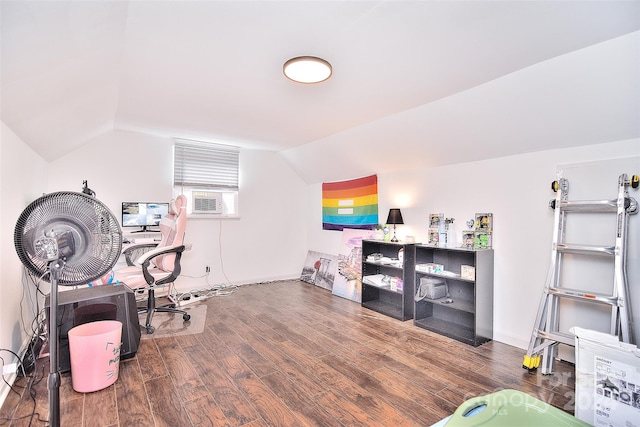 office space featuring cooling unit, vaulted ceiling, and dark hardwood / wood-style floors