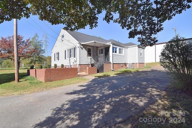 view of front of house featuring central AC