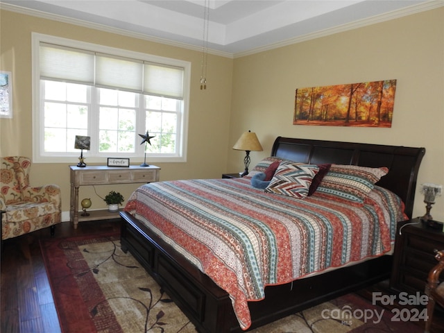 bedroom with ornamental molding and hardwood / wood-style floors