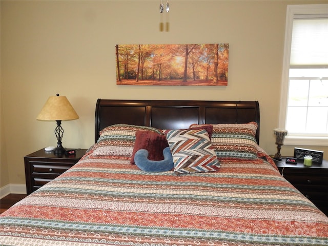 bedroom with hardwood / wood-style floors