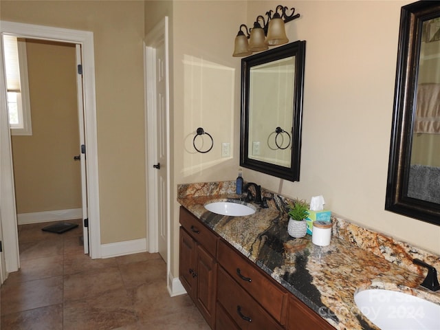 bathroom with vanity and an inviting chandelier