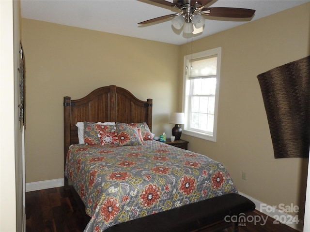 bedroom featuring dark hardwood / wood-style floors and ceiling fan