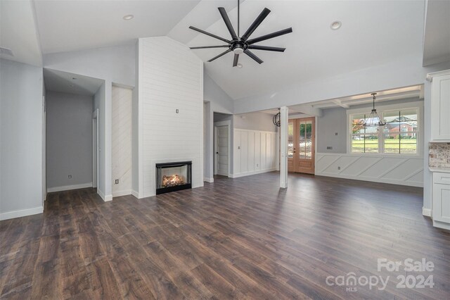 unfurnished living room with a large fireplace, ceiling fan, high vaulted ceiling, and dark hardwood / wood-style flooring