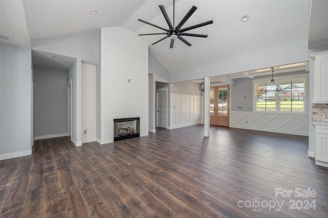 unfurnished living room featuring high vaulted ceiling, dark hardwood / wood-style floors, a large fireplace, and ceiling fan