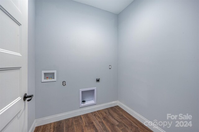 washroom with electric dryer hookup, dark hardwood / wood-style floors, and washer hookup