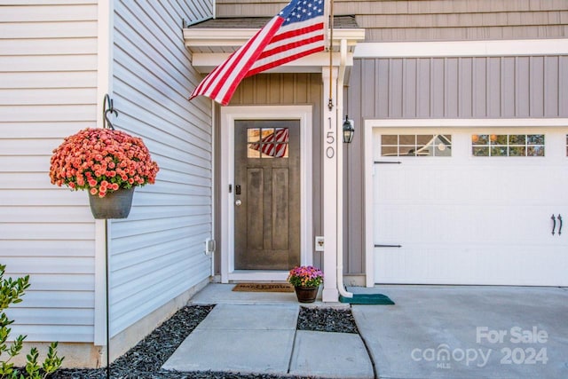 doorway to property featuring a garage