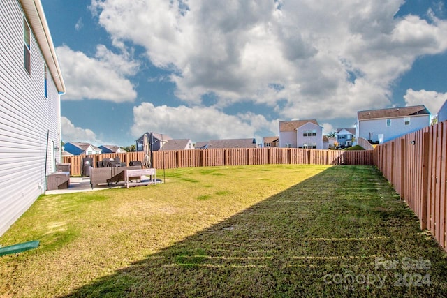 view of yard with a patio area and an outdoor living space