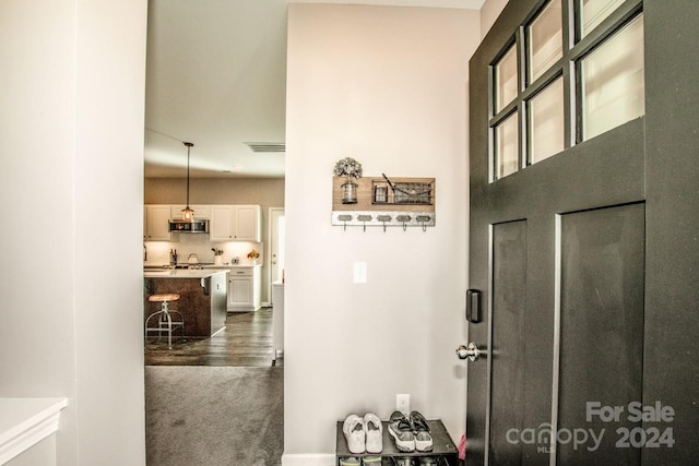 hallway with dark wood-type flooring