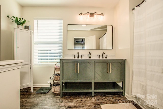 bathroom with vanity and wood-type flooring