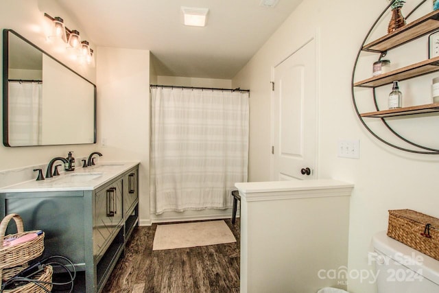 bathroom with vanity, a shower with curtain, hardwood / wood-style flooring, and toilet