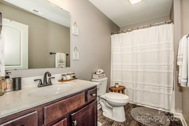 bathroom featuring vanity, toilet, wood-type flooring, and a shower with shower curtain