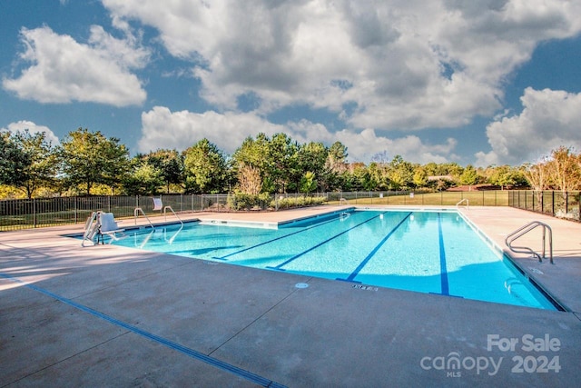 view of swimming pool featuring a patio area