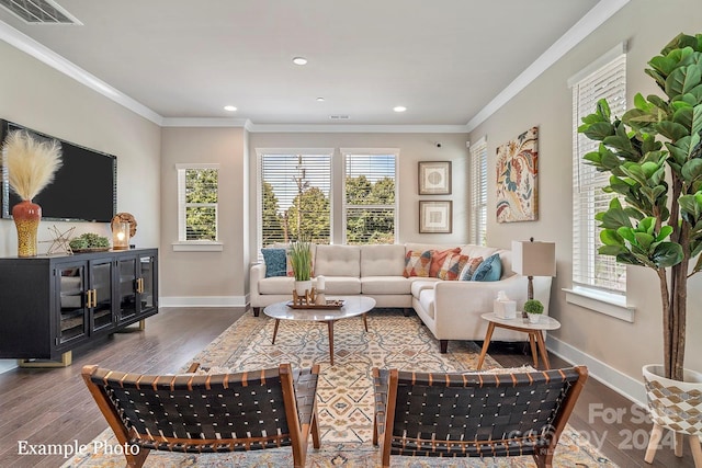 living area featuring crown molding, visible vents, wood finished floors, and baseboards
