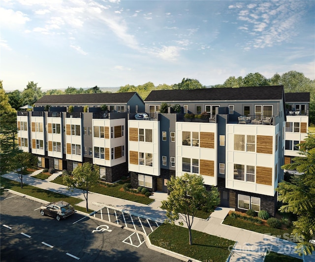 view of building exterior featuring uncovered parking