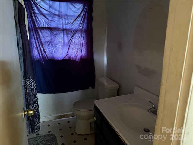 bathroom with toilet and vanity