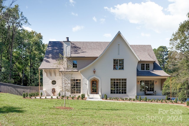 view of front of property with a front lawn