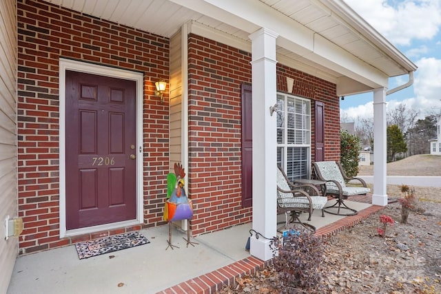 entrance to property featuring a porch