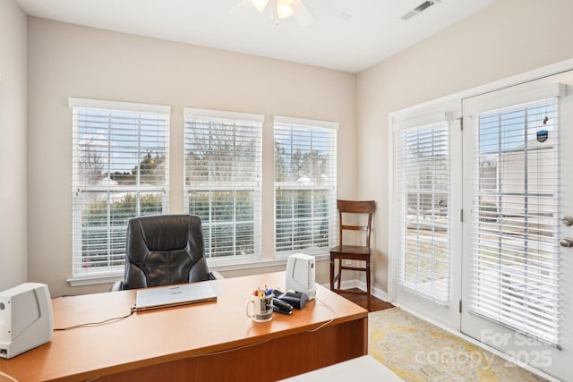 office space featuring plenty of natural light and ceiling fan