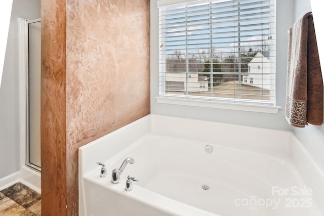 bathroom with shower with separate bathtub