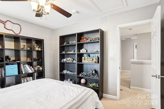 bedroom featuring light carpet and ceiling fan