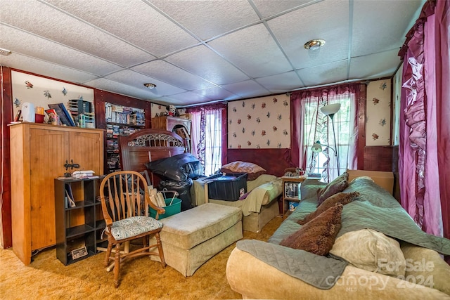 interior space with a paneled ceiling