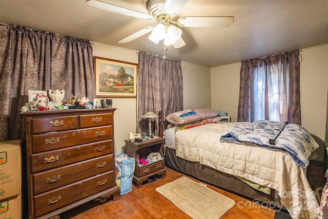 bedroom featuring hardwood / wood-style floors and ceiling fan