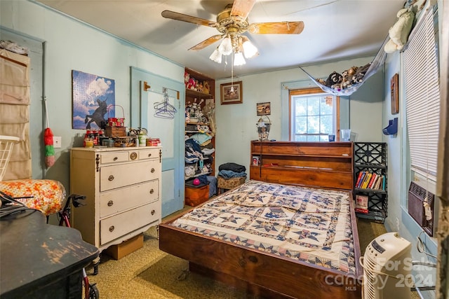 bedroom with ceiling fan and carpet flooring